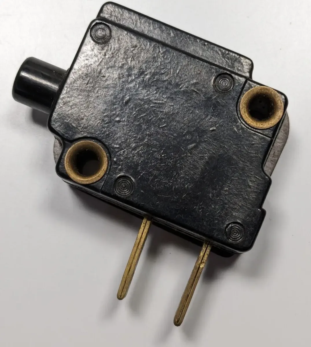 Kirby 110566 Switch(On Off Presslock) OEM D80 1CR Classic Fits Classic / Dual Sanitronic 80 The Kirby 110566 On/Off Presslock Switch is a genuine OEM foot-operated power switch assembly used to control the motor in early Kirby upright vacuum models such as the Classic, Dual Sanitronic 80, D50, and D80 series. It features a press-lock design that provides reliable on/off activation while maintaining safe electrical contact during operation.