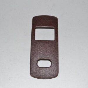 Kirby 111273 is a foot switch scuff plate assembly used on select Kirby upright vacuums, finished in rosewood color to protect the base and house the foot-operated controls. It is an OEM replacement part that restores both function and appearance of the vacuum’s lower housing.